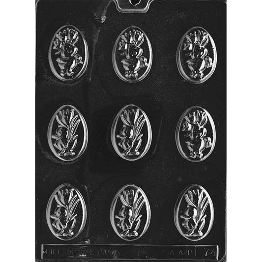 Ducklings with flowers chocolate mold featuring nine oval cavities on a dark plastic tray, each cavity showing a raised duckling and leafy flower sprig cameo design.