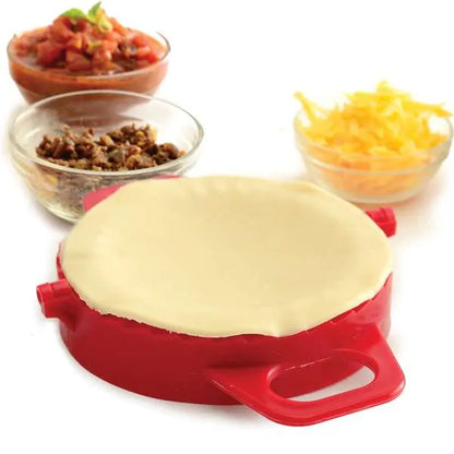 Dough placed on top of open dumpling press, ready for filling.