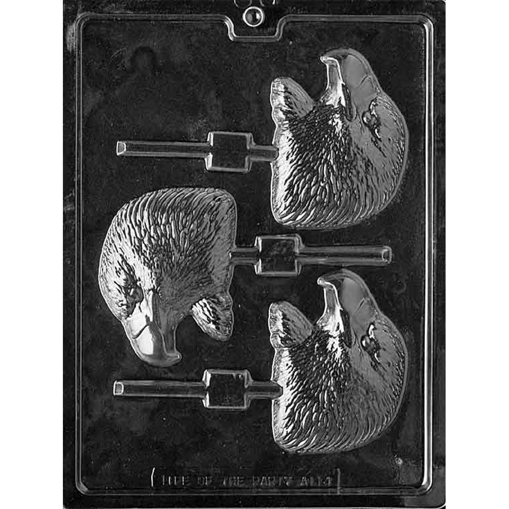 Clear Eagle Head Chocolate Lollipop Mold photographed against a black background with 3 detailed eagle head cavities featuring layered feathers, sharp beaks, and built-in stick channels.