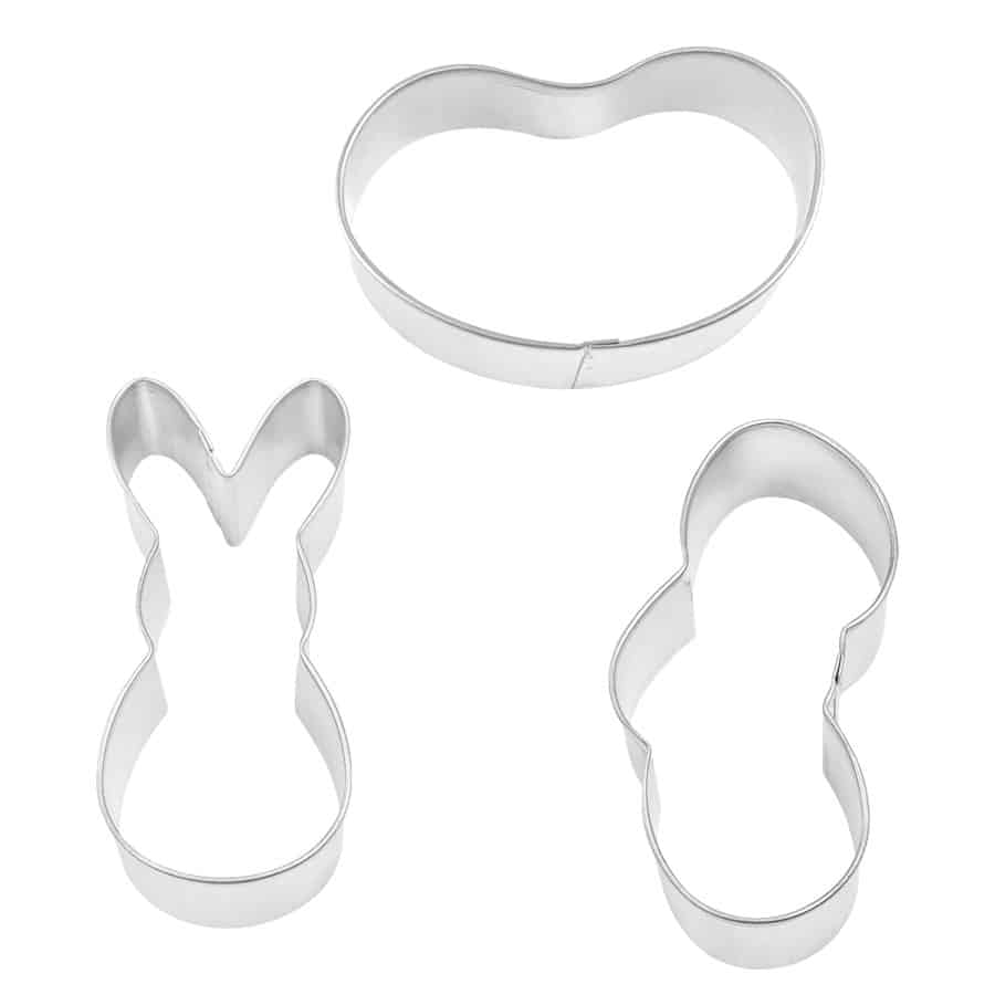 Three metal cookie cutters in bunny, jelly bean, and stacked egg shapes, displayed on a white background.