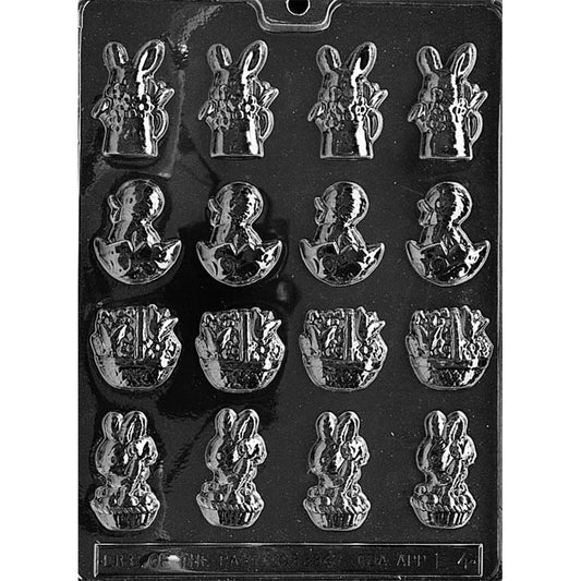 Clear plastic spring assortment chocolate mold shown on a black background with multiple mini cavities, including a bunny in a watering can, a hatching chick, a flower basket, and a bunny in a basket holding a carrot.