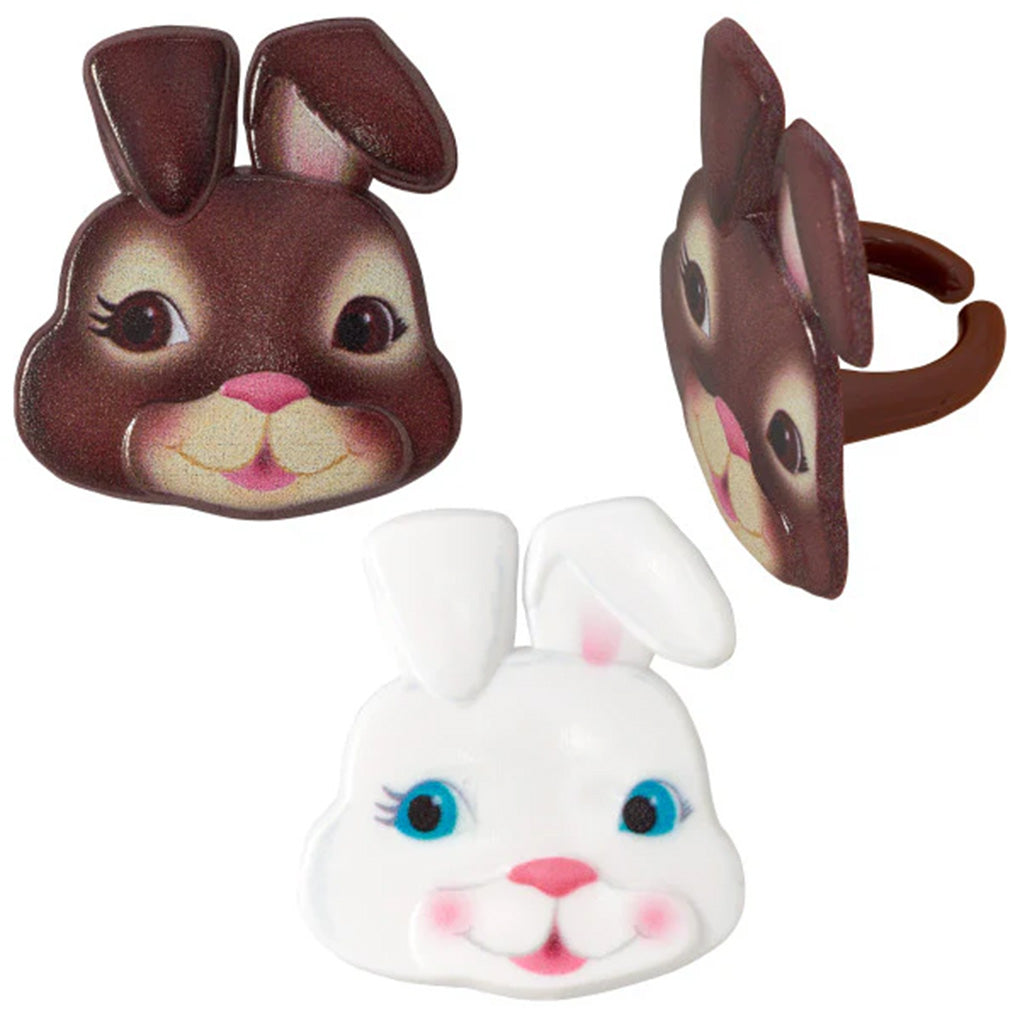 Assorted Easter bunny face cupcake rings featuring smiling white and brown rabbits with pink noses, tall ears, and brown ring bands on a white background.