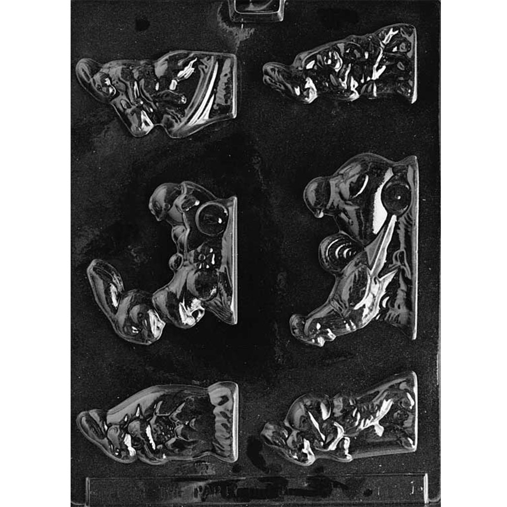 Clear plastic chocolate mold with assorted Easter scene cavities, including bunnies with eggs, bunnies pulling wagons with chicks, a bunny riding a horse, and a rooster wagon scene, on a dark background.