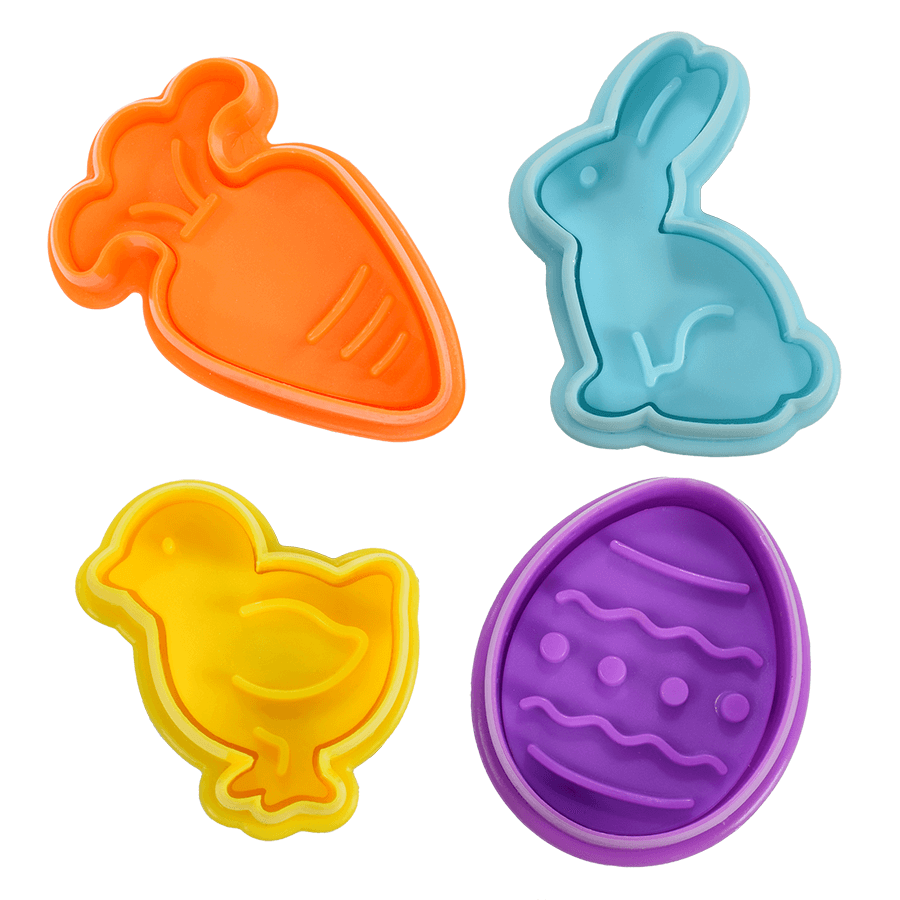 Close-up of the four pastel-colored cookie stampers in carrot orange, bunny blue, chick yellow, and egg purple.