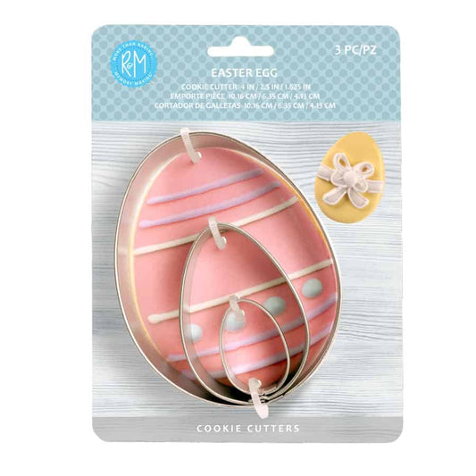 Easter egg cookie cutter set in packaging, featuring three nested metal cutters against a pastel background.