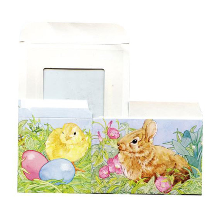 Side view of the Easter candy box showing watercolor-style artwork of a bunny, chick, and pastel eggs with the box open behind it.