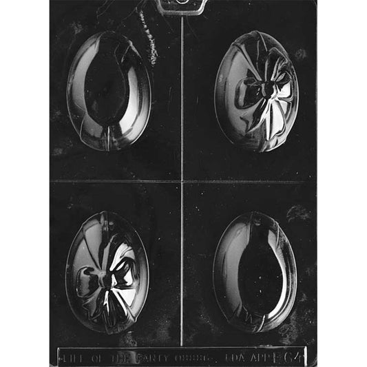 Clear plastic two-piece chocolate mold showing four egg halves: two smooth egg halves and two egg halves with a raised ribbon and bow detail, arranged on a dark background.