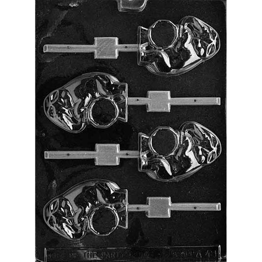 Clear plastic chocolate lollipop mold photographed against a black background, with four elephant-on-a-drum cavities, molded facial details, round drums, and individual stick channels.