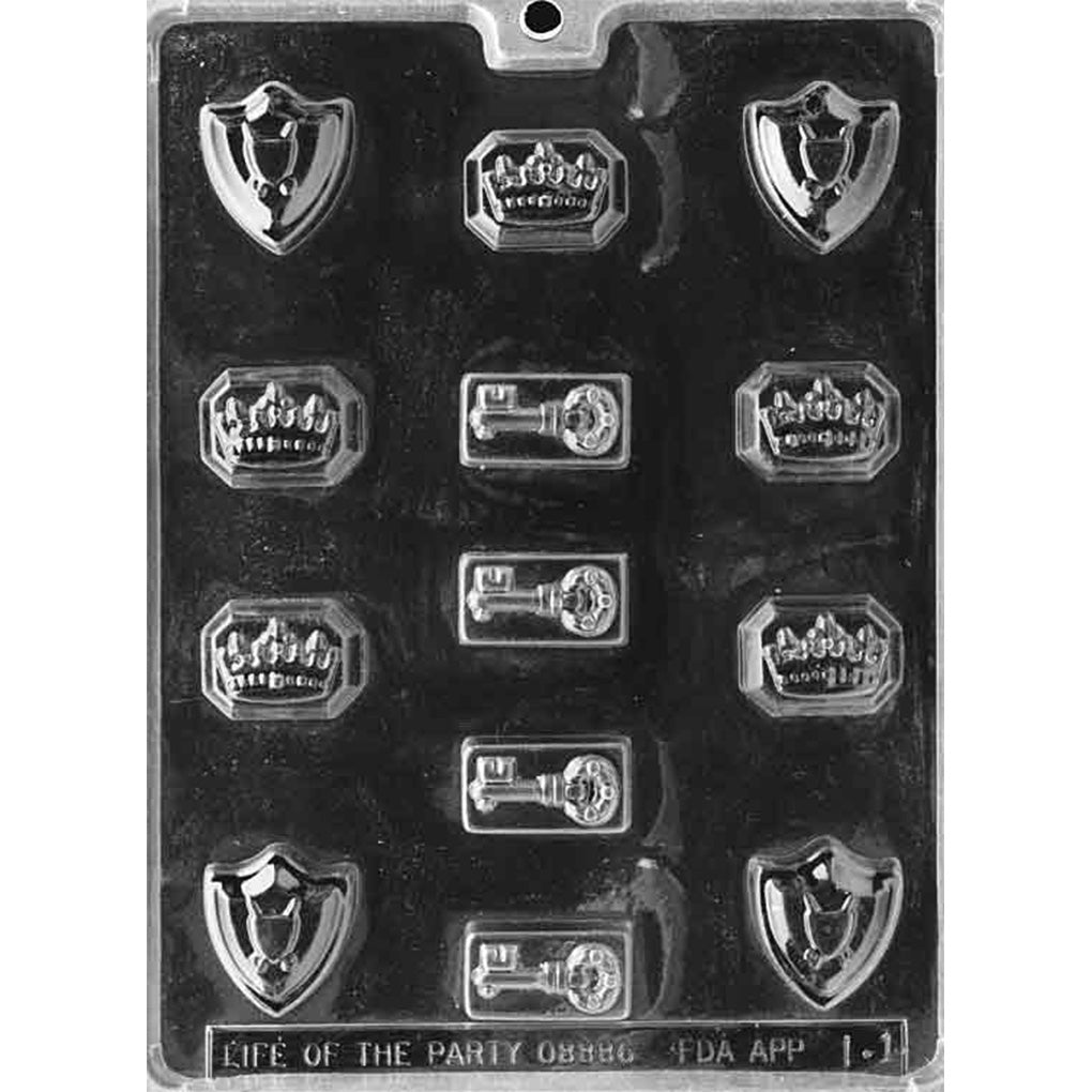 Clear chocolate mold with 13 small England-themed cavities, including pointed crowns, old-fashioned keys, and shield-shaped pieces with crests.