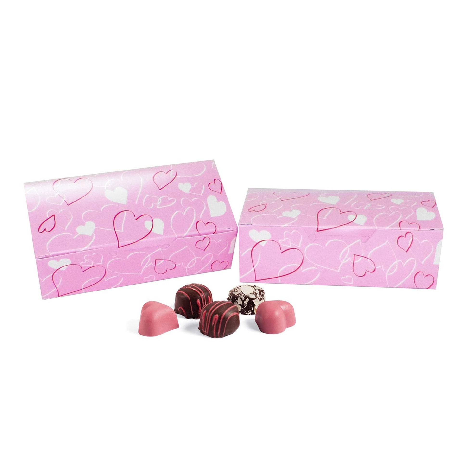 Two pink “Entangled Hearts” candy boxes with assorted chocolates in front on a white background.