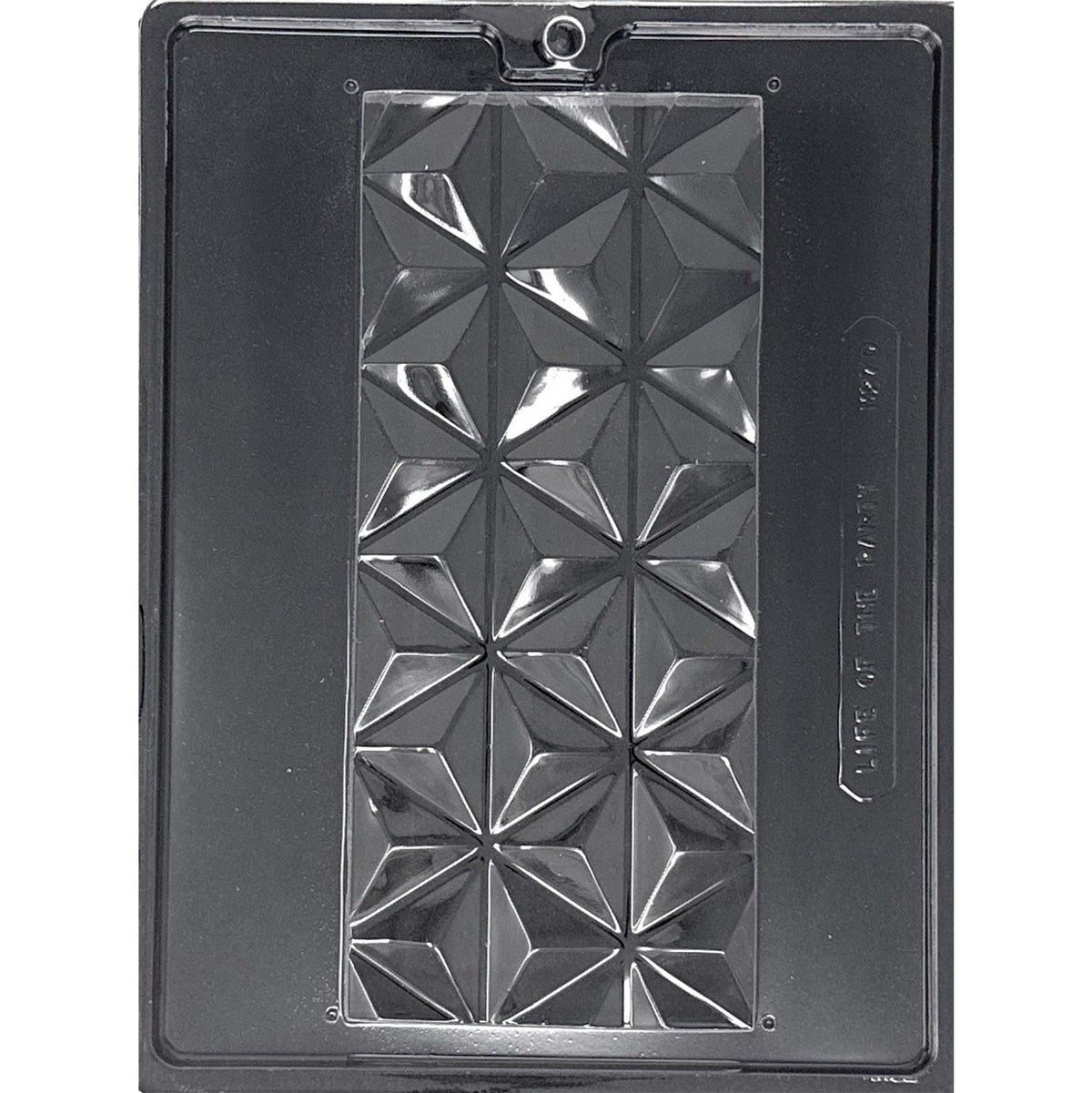 Clear Extra Large Dubai Chocolate Bar Mold photographed against a black background, featuring one long rectangular 1-pound bar cavity with a bold faceted geometric pattern.