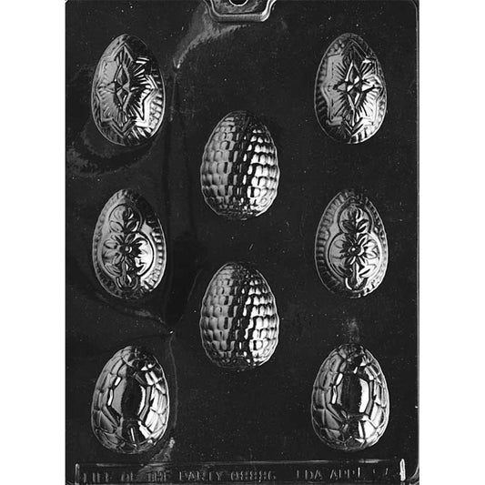 Clear plastic fancy Easter eggs chocolate mold with eight small egg cavities, each featuring raised ornate patterns such as quilted texture, scrollwork, and decorative medallion designs.