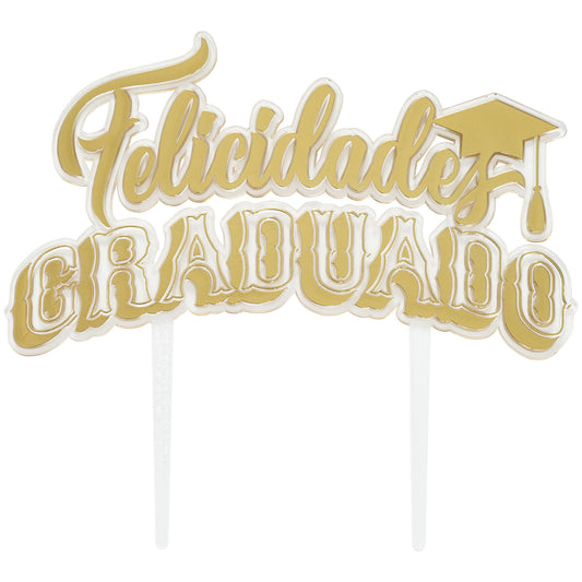 Close-up of a Felicidades Graduado cake topper in gold foil with a clear outline and two clear pick stems, featuring a graduation cap graphic on the right.