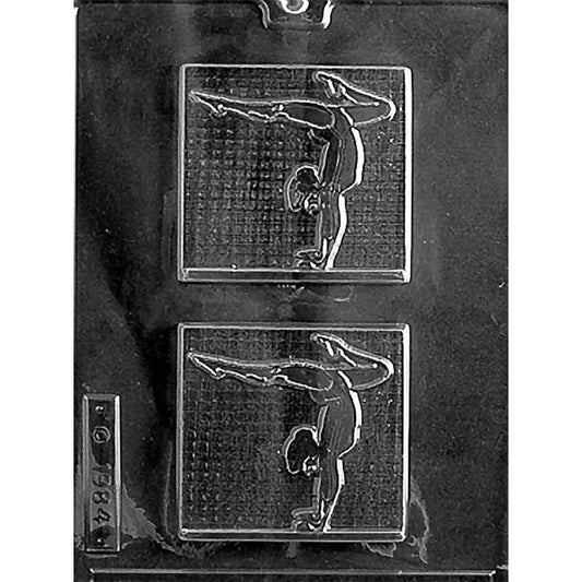 Clear plastic chocolate mold with 2 square bar cavities showing a female gymnast in an inverted balance pose against textured backgrounds.