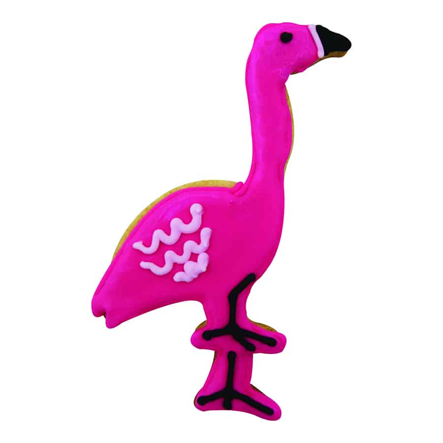 Bright pink flamingo-shaped cookie with black and white icing details, decorated with a wavy wing pattern.