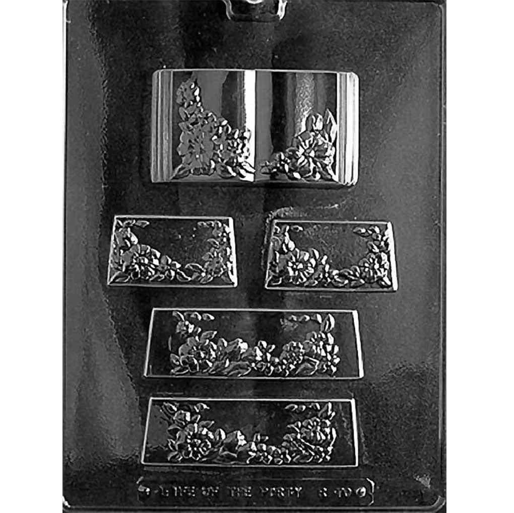 Five-cavity floral book and stand chocolate mold with one open book, smooth page centers, and four decorated stand panels