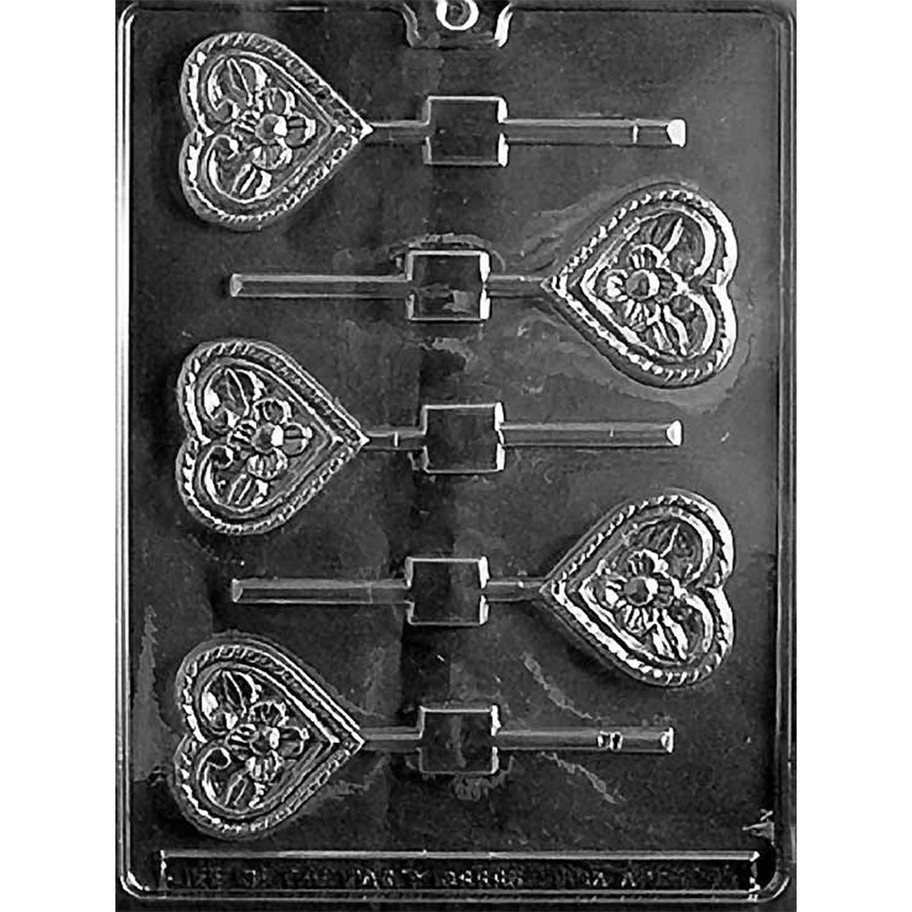 Clear chocolate lollipop mold with six small heart-shaped cavities featuring a flower design in the center.