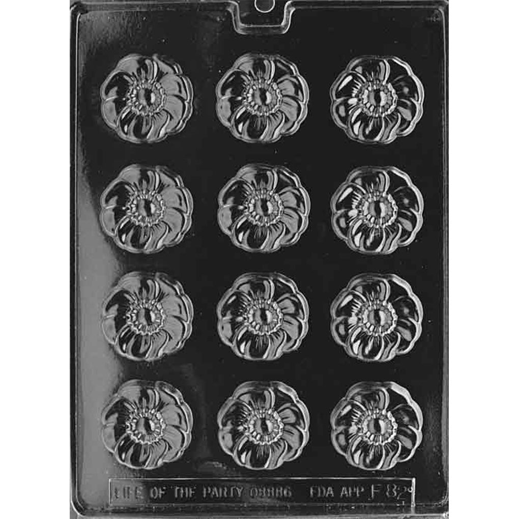 Black plastic chocolate candy mold with 12 flower-shaped cavities featuring ruffled petals and a textured center for mint-sized floral chocolates.