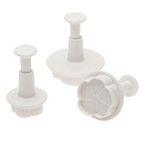 Flower-shaped plunger cutters in different sizes, ideal for cake decorating and baking projects.