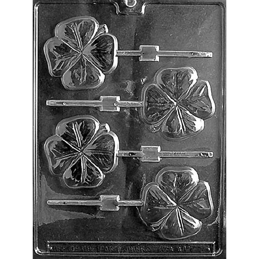 Plastic chocolate mold with four cavities shaped like detailed four-leaf clovers, each designed to create lollipops with realistic veined leaves and stick slots.