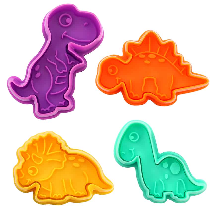 Set of four colorful dinosaur-shaped cookie stampers in purple, orange, yellow, and green, featuring T-Rex, Stegosaurus, Triceratops, and Brontosaurus.