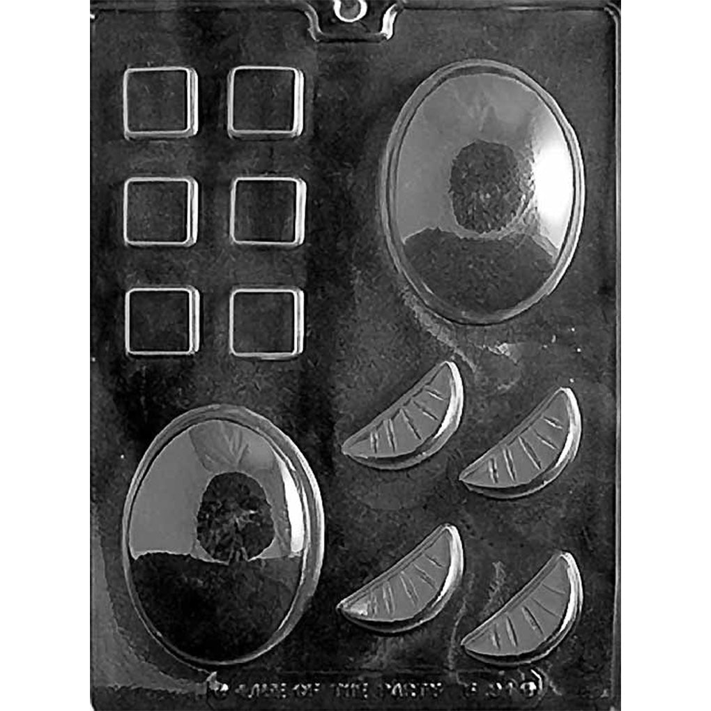 Clear chocolate mold with two large oval cavities, six small square cavities, and four wedge-shaped cavities resembling citrus slices with segment lines.