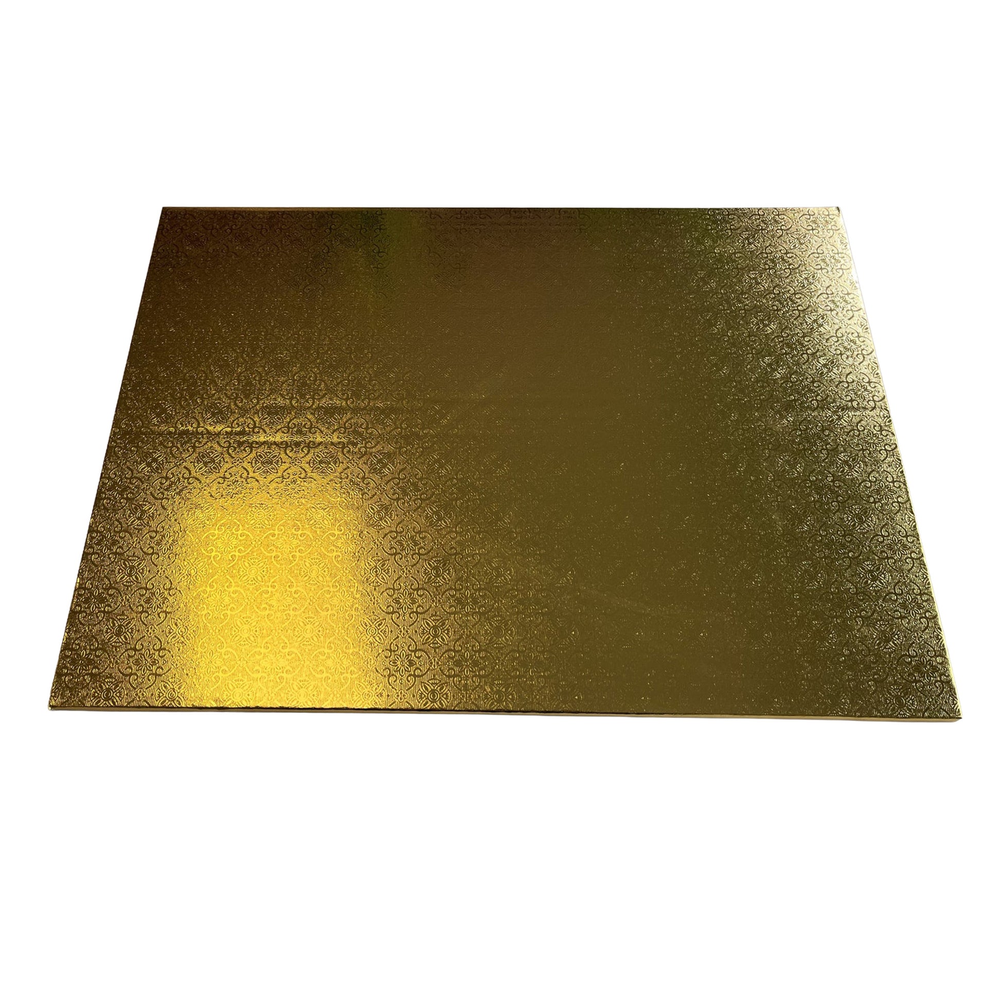 Large rectangular foil wrapped cake board in metallic gold with an embossed decorative pattern, photographed on a white background.