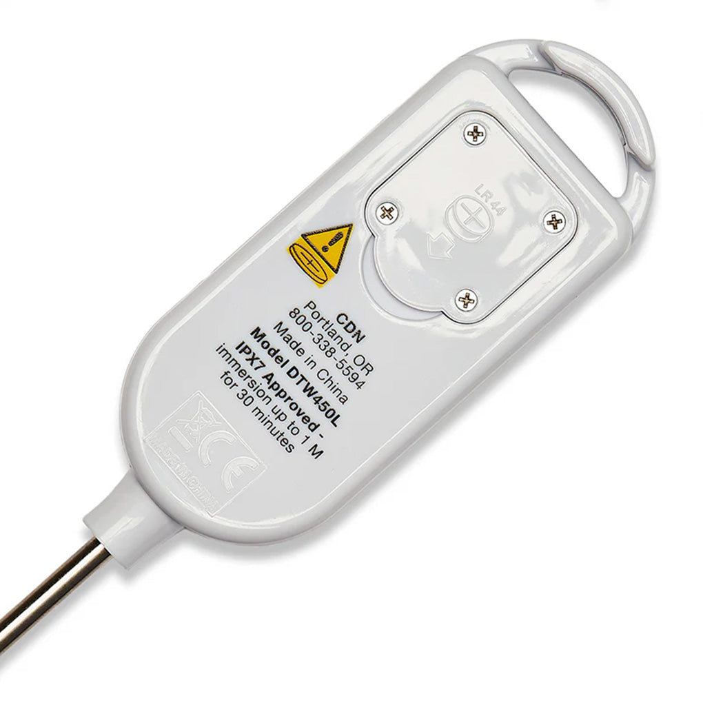 Back view of the white thermometer body showing battery compartment screws, warning icon, and printed model information.