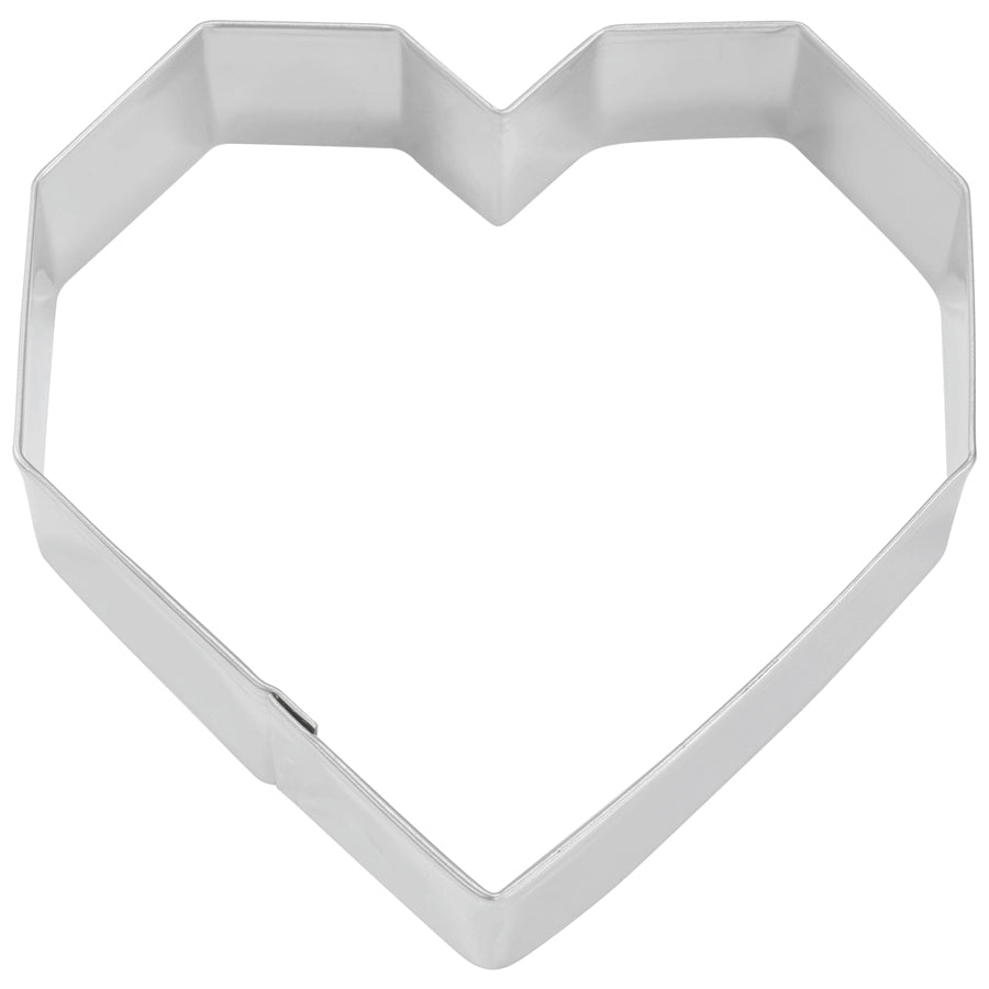 Top-down view of a geometric heart cookie cutter with sharp angles and a faceted design.