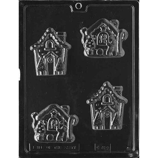 Clear chocolate mold with four gingerbread house cavities in two different designs, featuring peaked roofs, windows, doors, and candy-style holiday decorations.