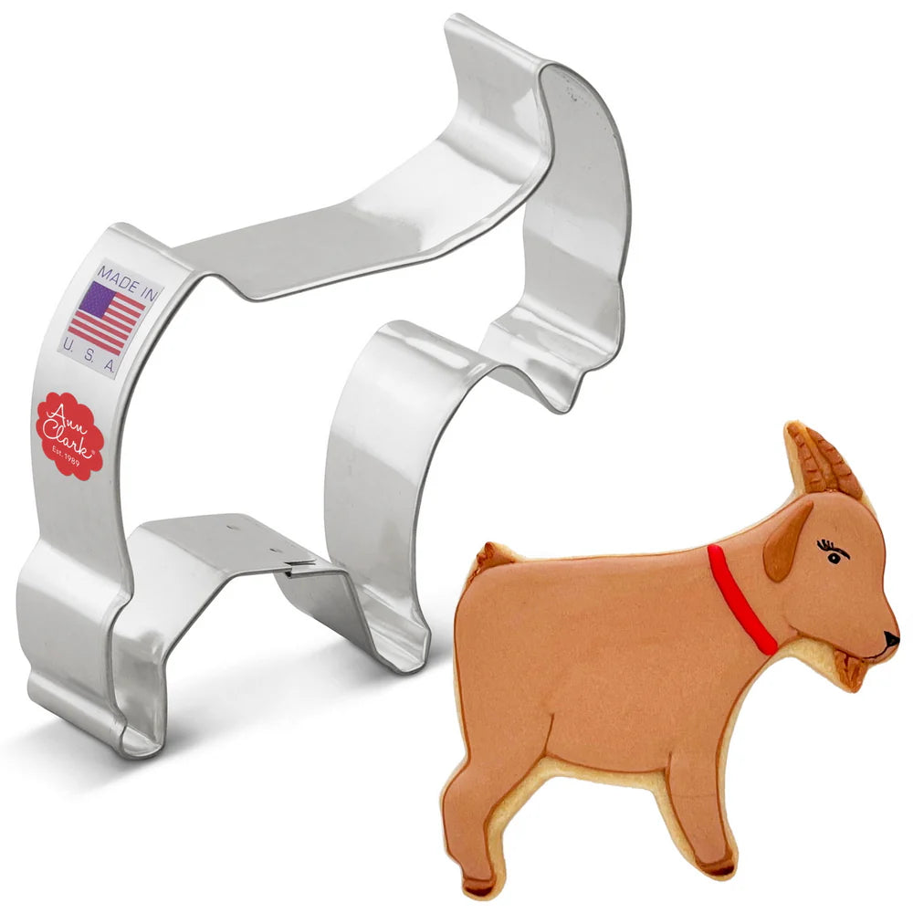 4-inch Goat Cookie Cutter made of metal, displayed alongside a decorated goat-shaped cookie with brown icing, a red collar, and horn details.