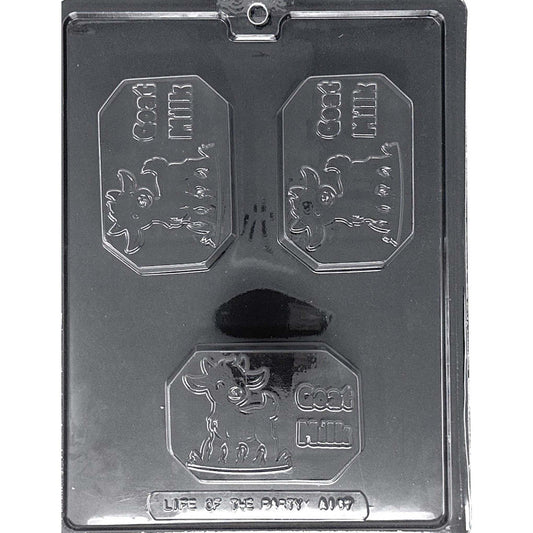 Clear Goat Milk Chocolate Bar Mold photographed against a black background with three rectangular cavities featuring goat designs and raised “GOAT MILK” lettering.