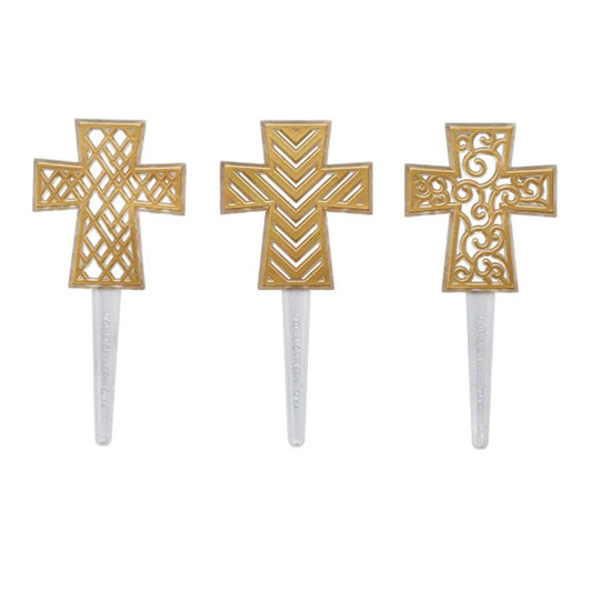 Three Gold Cross DecoPics cupcake picks with lattice, chevron, and scrolling openwork designs shown on clear stems.
