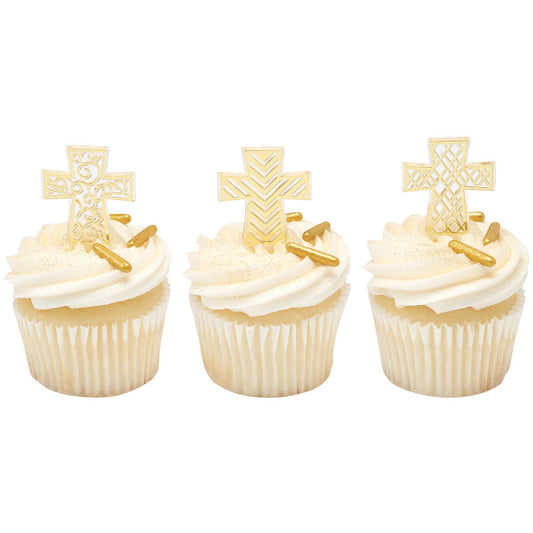 Three white cupcakes with white frosting and gold sprinkles, each topped with a different decorative gold cross cupcake pick.
