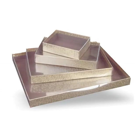 Stacked burnished gold candy boxes with clear lids in assorted sizes, showing the warm metallic bases and transparent tops against a white background.
