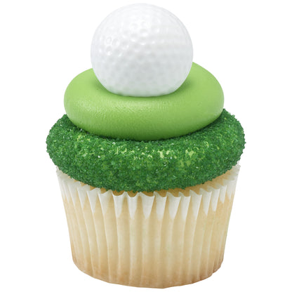 Vanilla cupcake in a white wrapper topped with a green frosting ring and green sugar crystals, finished with a white dimpled golf ball cupcake ring.