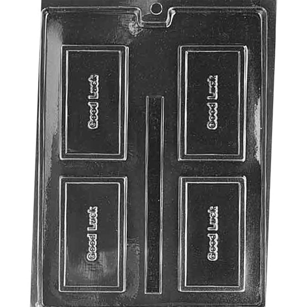Clear plastic chocolate bar mold with four rectangular cavities, each reading “Good Luck” in raised lettering with a thin rectangular border, on a dark background.