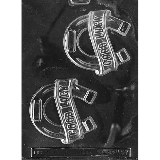 Good luck horseshoe chocolate mold with two large horseshoe cavities, each featuring a raised banner that reads “GOOD LUCK,” shown in clear plastic.