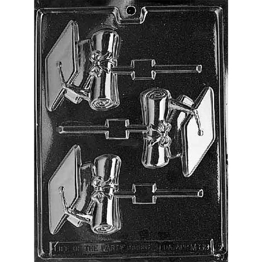 Clear plastic graduation chocolate lollipop mold with three cavities showing a mortarboard cap beside a rolled diploma tied with a bow, each with a stick channel.
