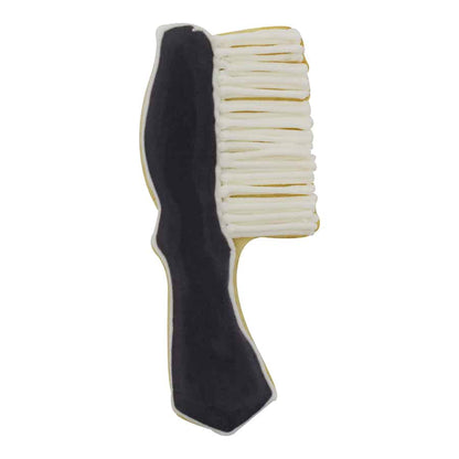 Decorated hairbrush cookie with black handle and white bristles made from icing.