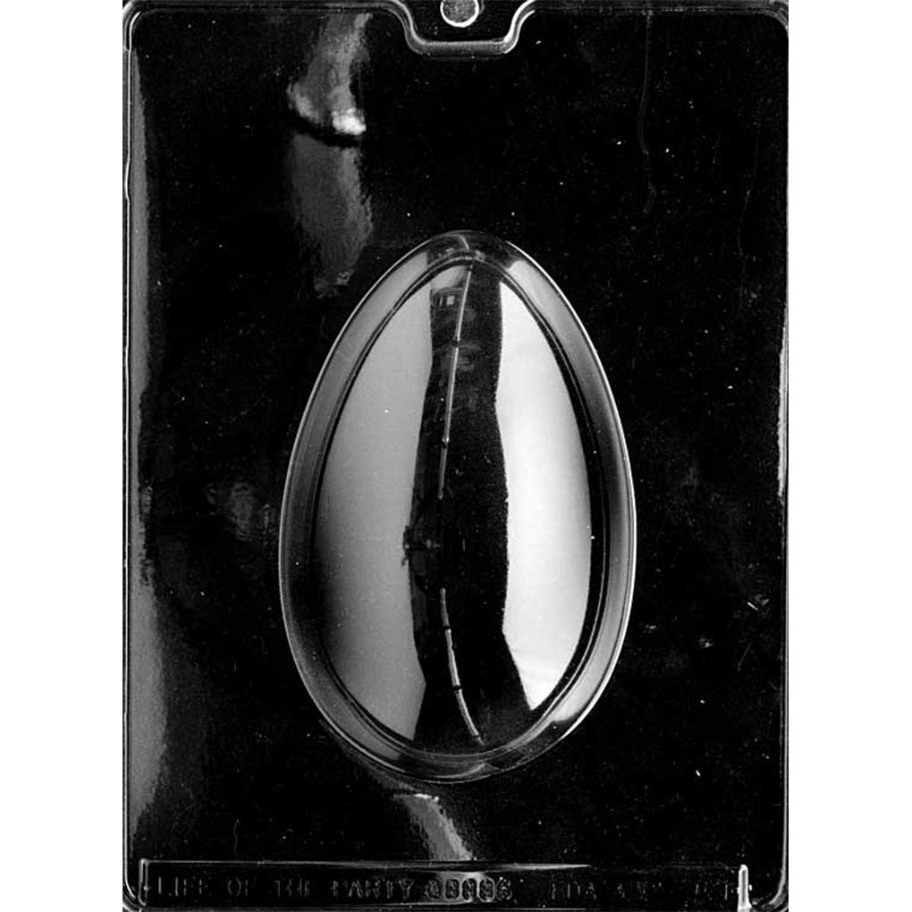 Clear single-cavity 1/2 lb egg chocolate mold on dark backing, forming a tall smooth oval egg for Easter candy making and foil-wrapped chocolate gifts.