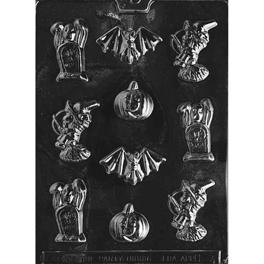 Clear Halloween assortment chocolate mold photographed on a black background with cavities shaped like a ghost behind a gravestone, a witch on a broom, a bat, and a jack-o’-lantern pumpkin.