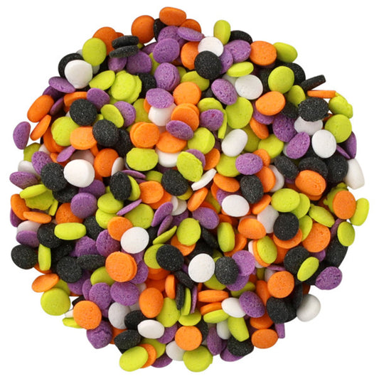 Close-up pile of Halloween sequin sprinkles in bright orange, black, white, lime green, and purple flat round shapes on a white background.