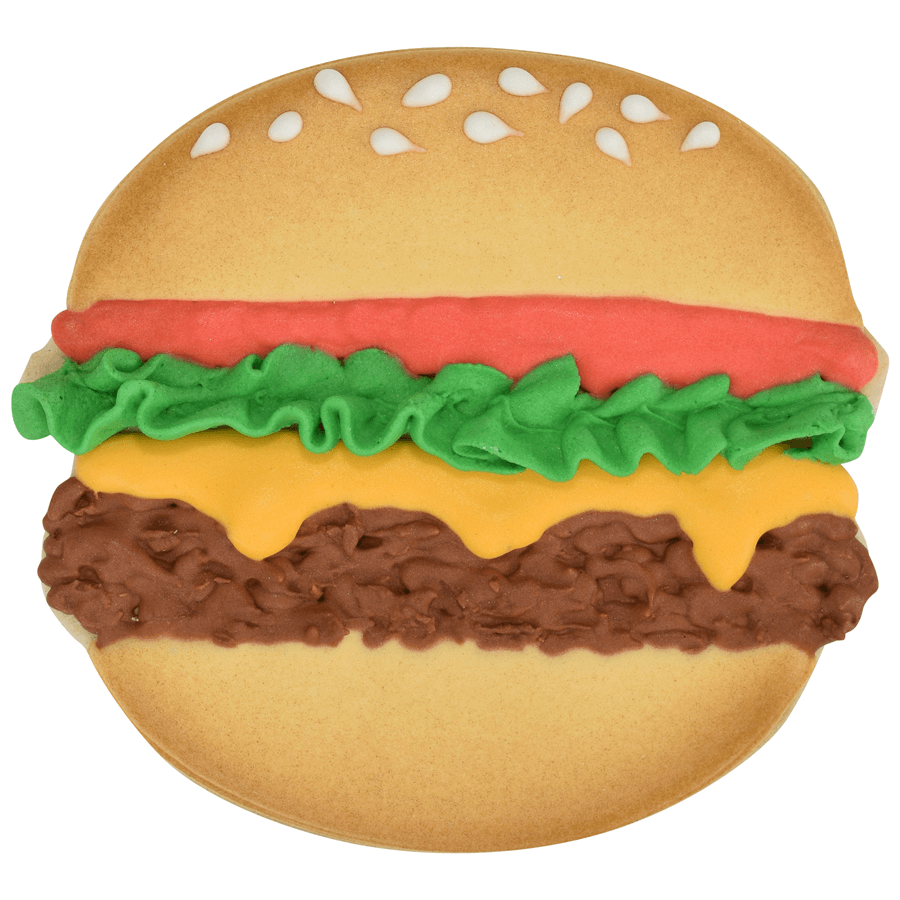 Decorated cookie shaped like a cheeseburger with lettuce, tomato, cheese, and sesame seeds on the bun.