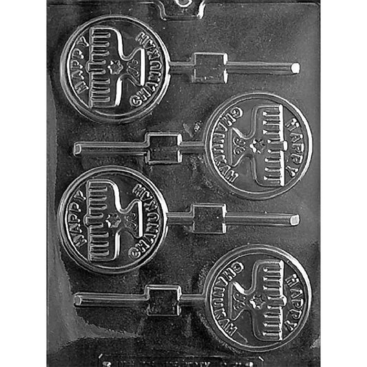 Clear chocolate lollipop mold with four round cavities featuring raised menorahs and the words “Happy Chanukah,” each connected to a straight stick channel.