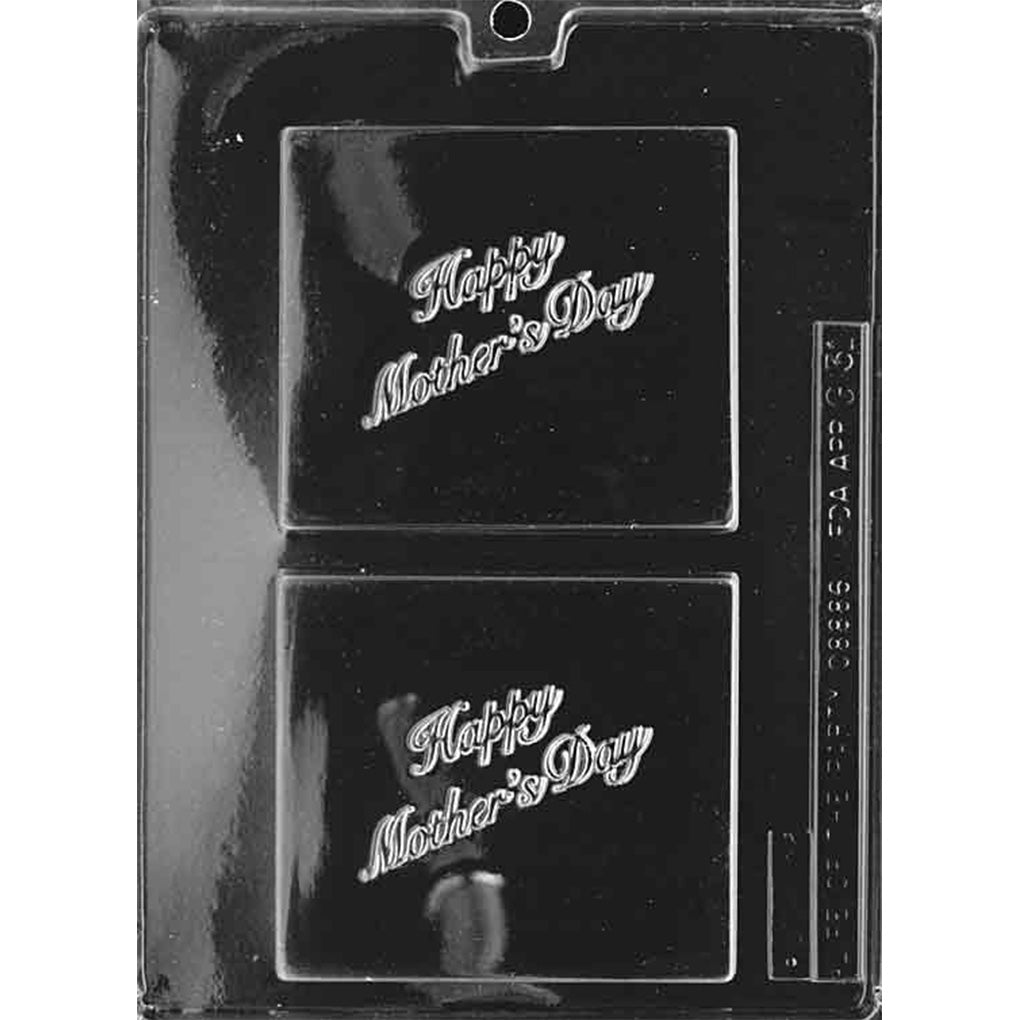 Clear plastic chocolate mold with two square plaque cavities embossed with the words “Happy Mother’s Day,” shown on a dark background.