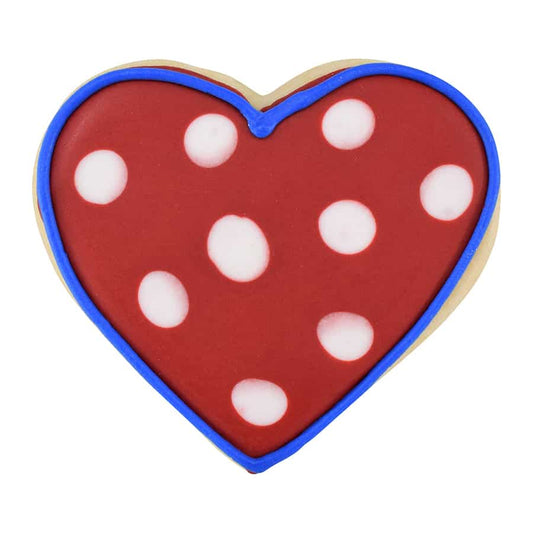 Decorated heart cookie with red icing, white polka dots, and blue outline