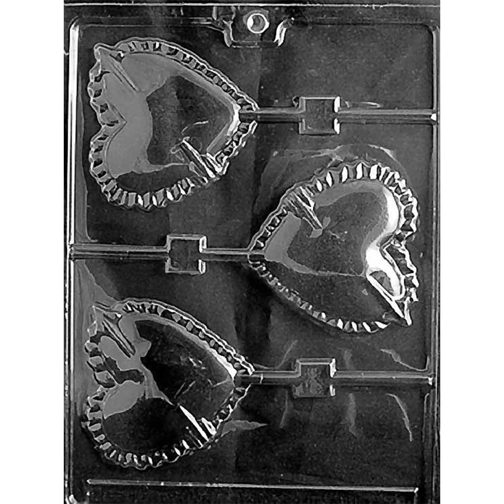 Clear plastic chocolate lollipop mold with three large heart cavities featuring arrows, ridged borders, and built-in stick channels