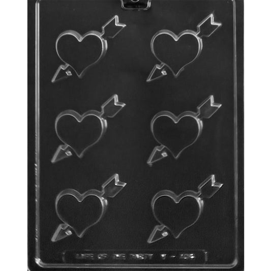 Clear Heart with Arrow Chocolate Mold photographed against a black background with six smooth heart cavities pierced by diagonal arrows