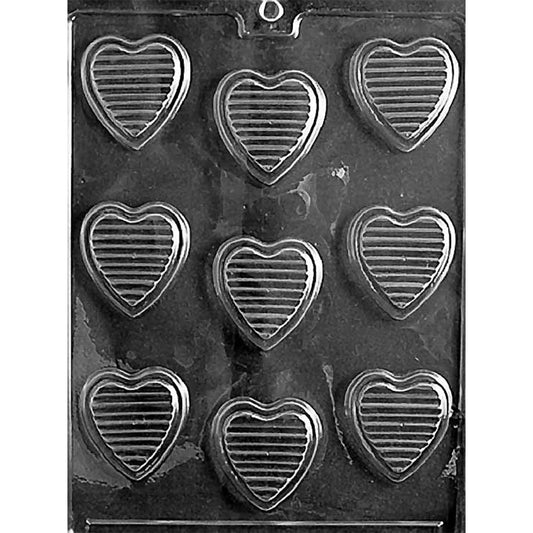 Clear Hearts with Ridges Chocolate Mold photographed against a black background with nine heart-shaped cavities featuring evenly spaced horizontal ridges.